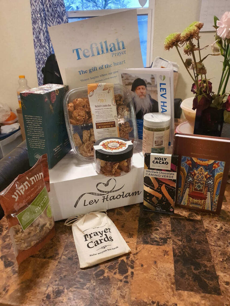 Recipient with a Lev Haolam gift box from the Holy Land