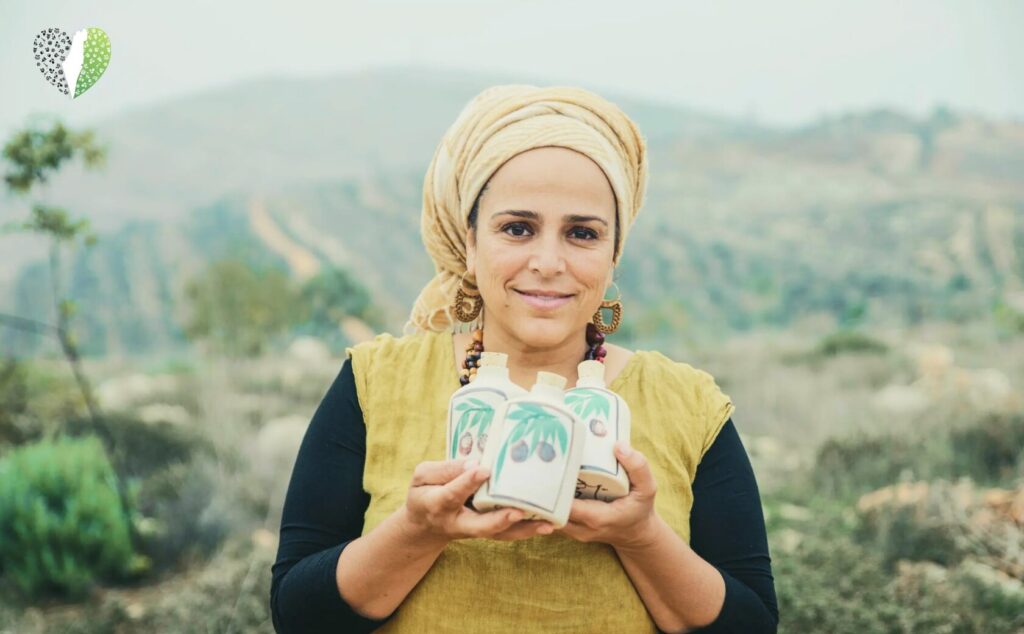 Batya Erdstein crafting a ceramic piece with care
