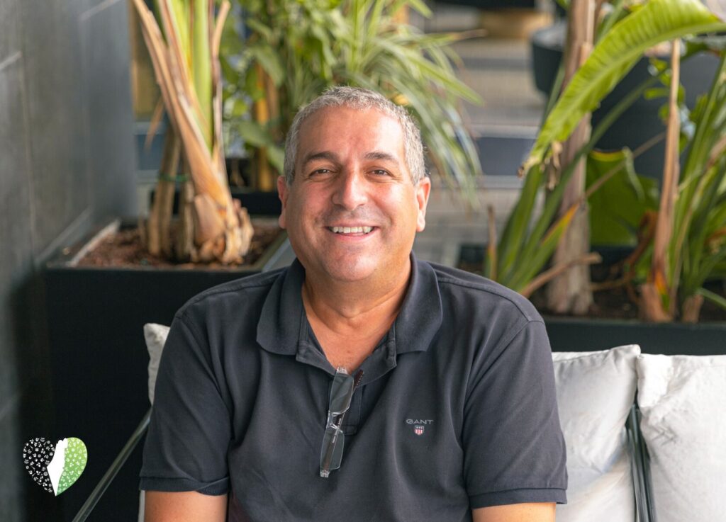 Idan Zait standing near the Dead Sea with salt crystals