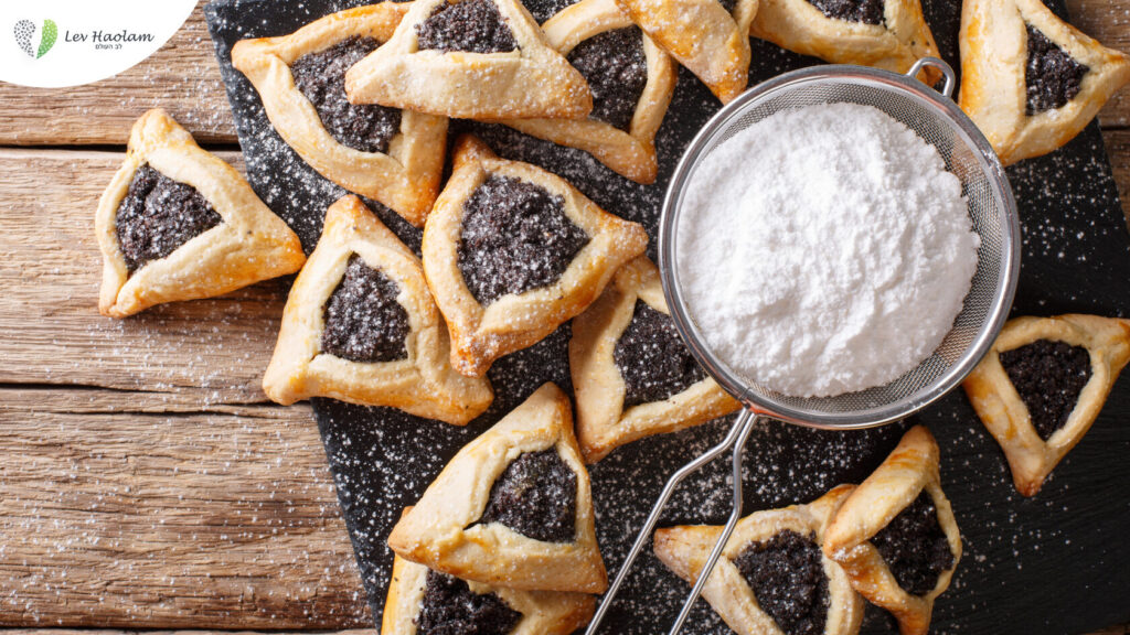 A plate of Oznei Haman cookies with poppy seeds
