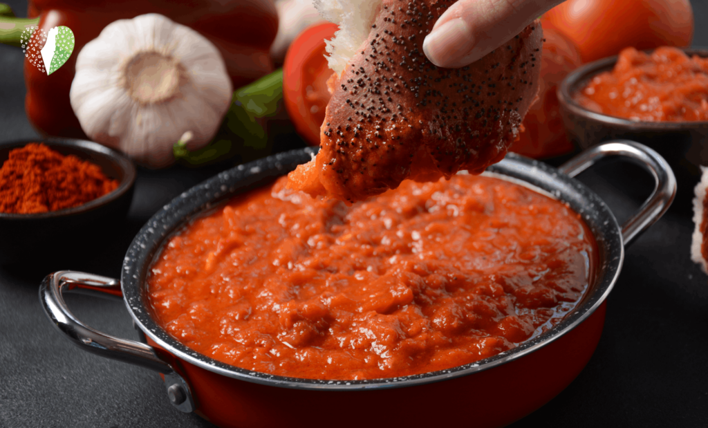 Close-up of matbucha simmering on a stove