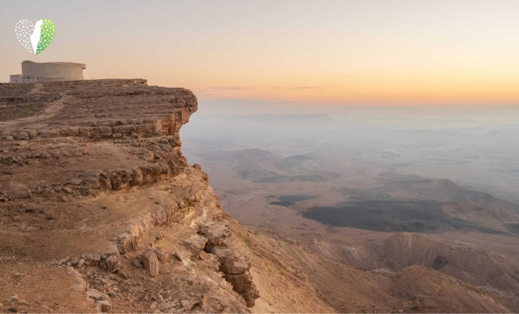 Aerial view of Negev desert with winding roads and cliffs