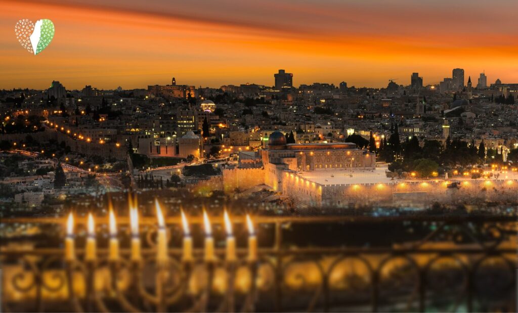 Outdoor menorah lighting ceremony with a large crowd