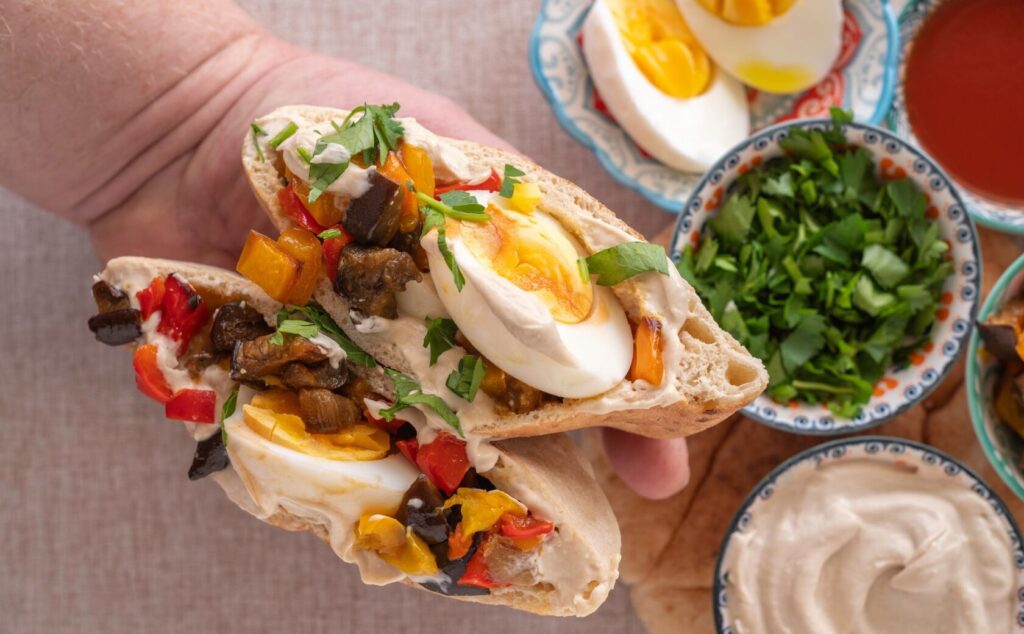 Close-up of Sabich filled with eggplant and egg
