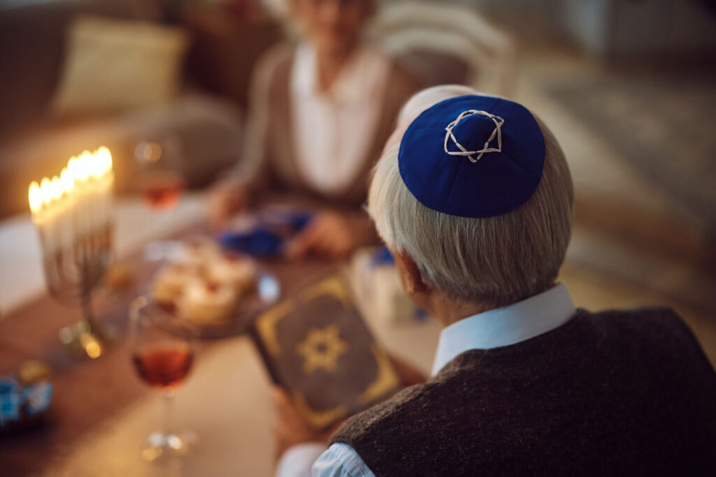 Children playing with dreidels during Hanukkah