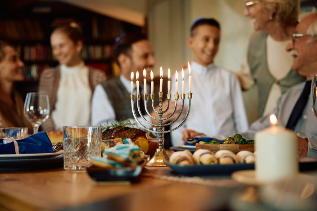 Menorah glowing with bright Hanukkah lights