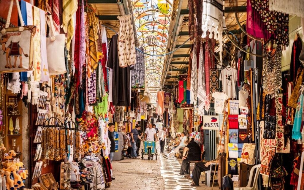 Narrow winding streets of the Old City filled with market stalls
