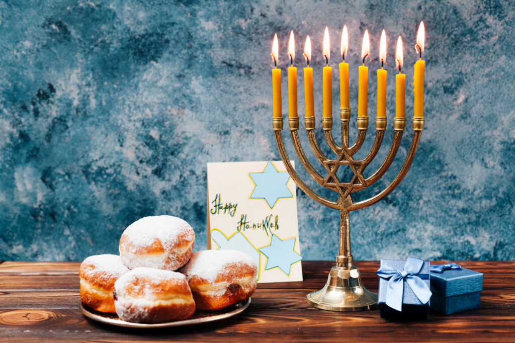 Menorah candles glowing during Hanukkah celebration