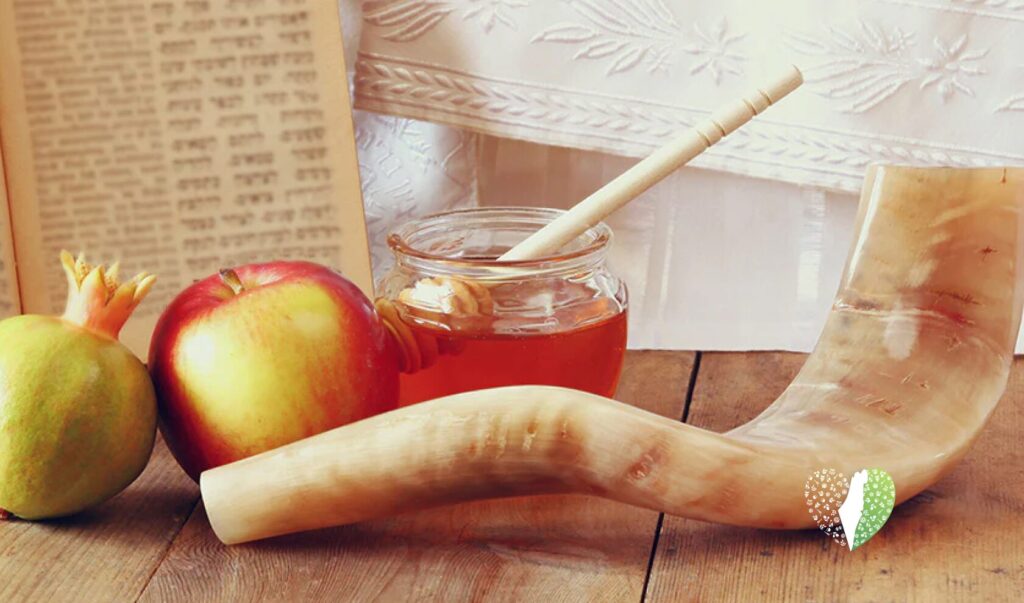 A table set with traditional Rosh Hashanah foods
